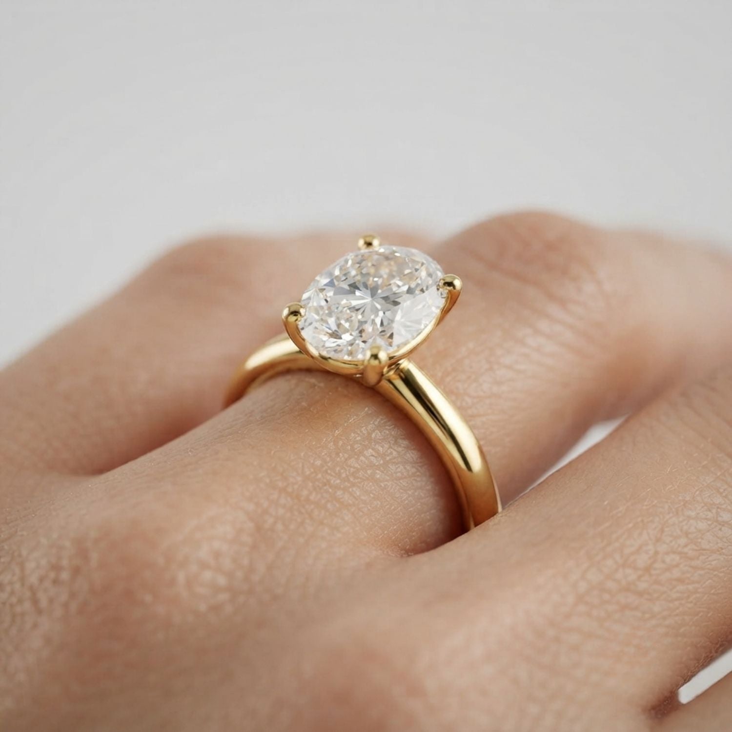 Classic Oval Diamond Solitaire Ring With Sleek Gold Finish