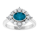 Oval London Blue Topaz & Diamond Halo Ring in Gold and Platinum