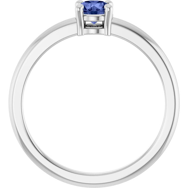 Round Tanzanite Solitaire Ring in Gold and Platinum
