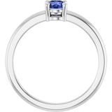 Round Tanzanite Solitaire Ring in Gold and Platinum