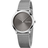 Silver Calvin Klein watch with mesh band on a white background