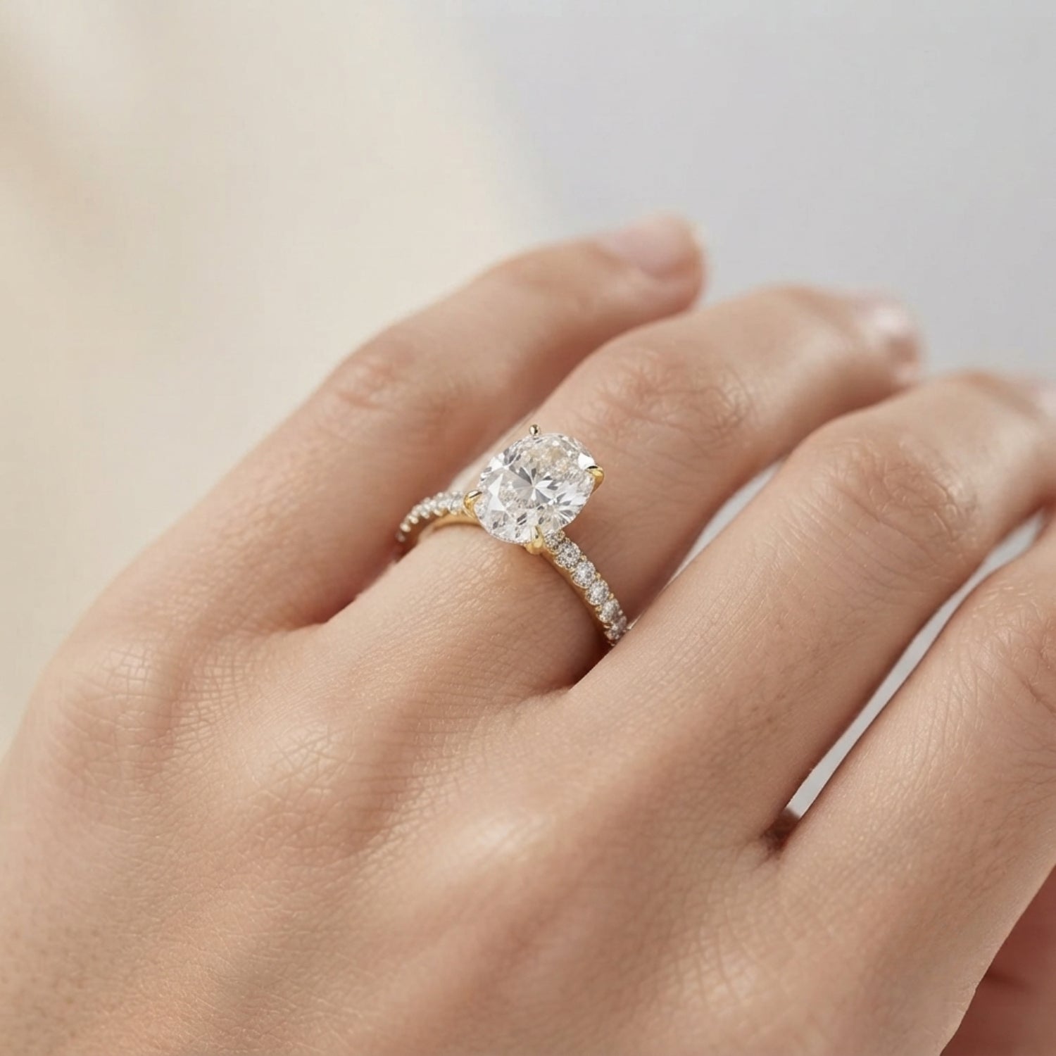Oval Diamond Solitaire Ring with Pavé Diamond Band in White Gold