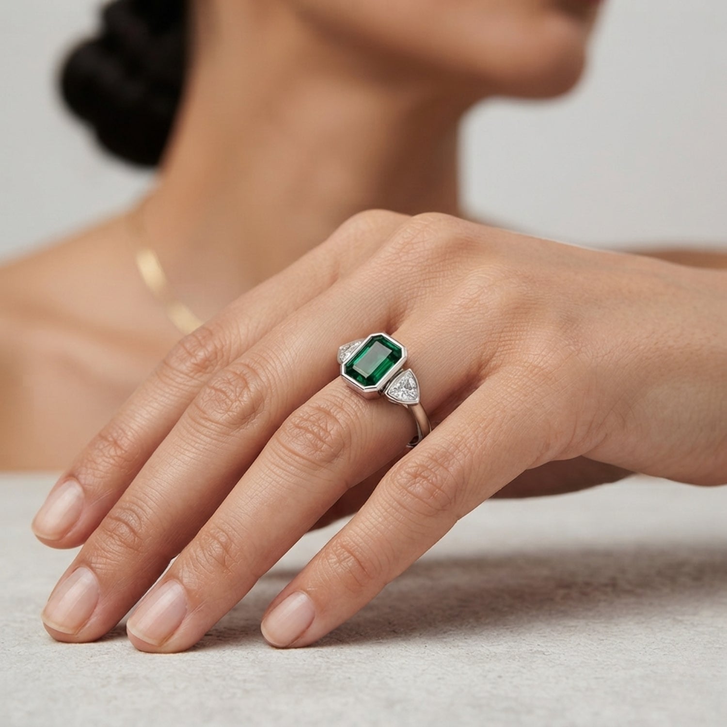 Emerald Cut Green Emerald Three Stone Ring with Trillion Diamond Side Stones | Bezel Set