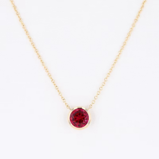 Bezel-Set Round Ruby Solitaire Pendant Necklace.