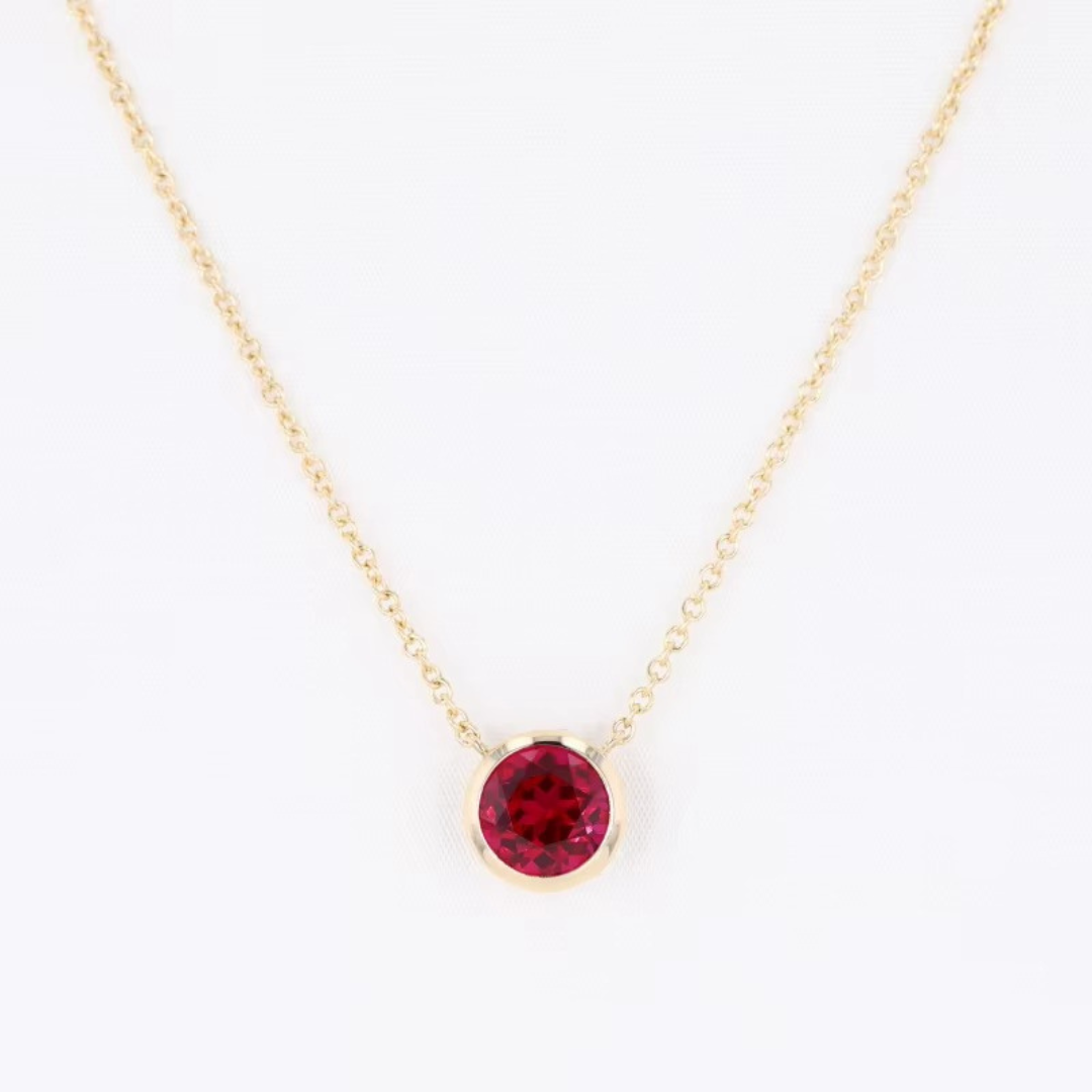 Bezel-Set Round Ruby Solitaire Pendant Necklace.