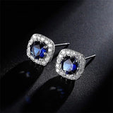 1.00Ct Sapphire Blue and Round Lab Grown Diamond Studs Earring in Gold