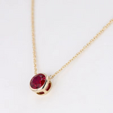 Bezel-Set Round Ruby Solitaire Pendant Necklace.