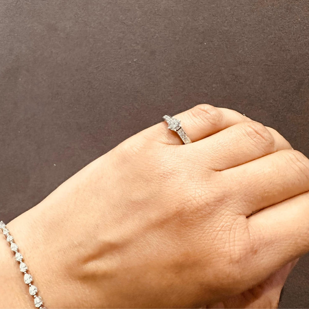 side stone round diamond ring