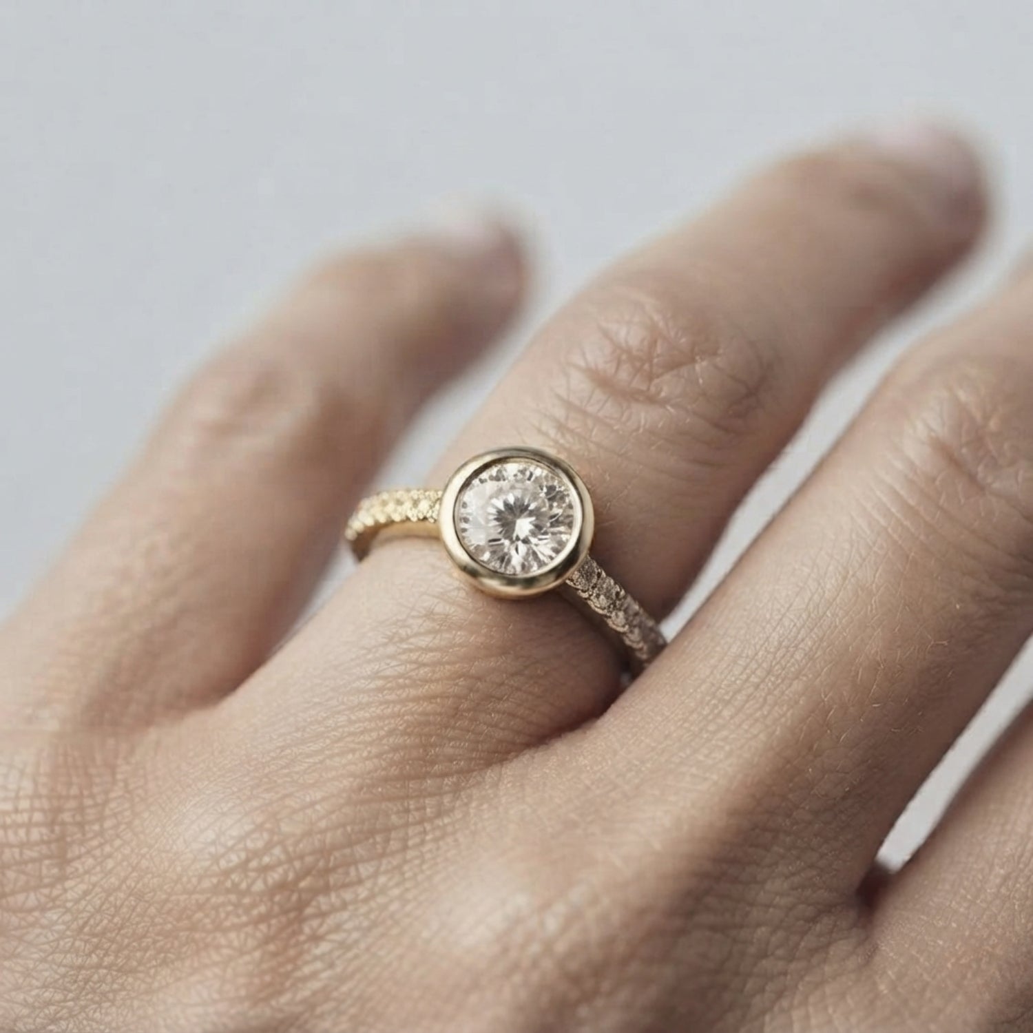 Round Diamond Bezel Set Solitaire Ring with Pavé Band in White Gold