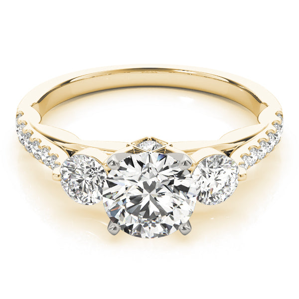 Gold ring with three diamonds on a white background