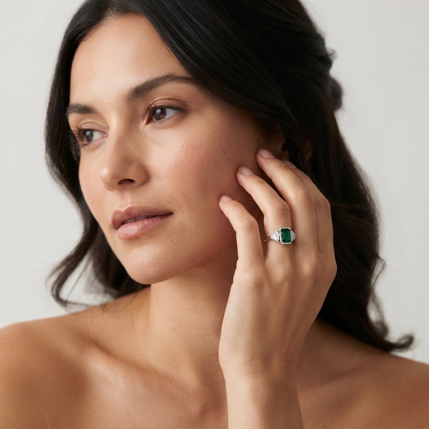 Emerald Cut Green Emerald Three Stone Ring with Trillion Diamond Side Stones | Bezel Set