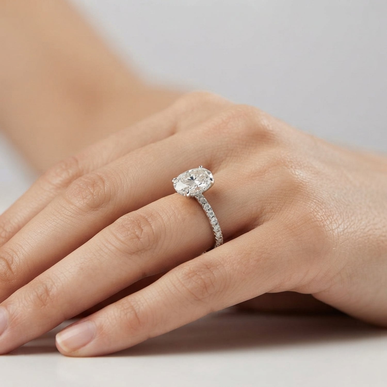 Oval Diamond Solitaire Ring with Pavé Diamond Band in White Gold