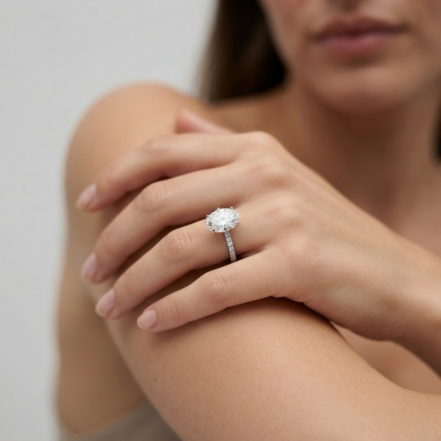 Oval Diamond Solitaire Ring with Pavé Diamond Band in White Gold