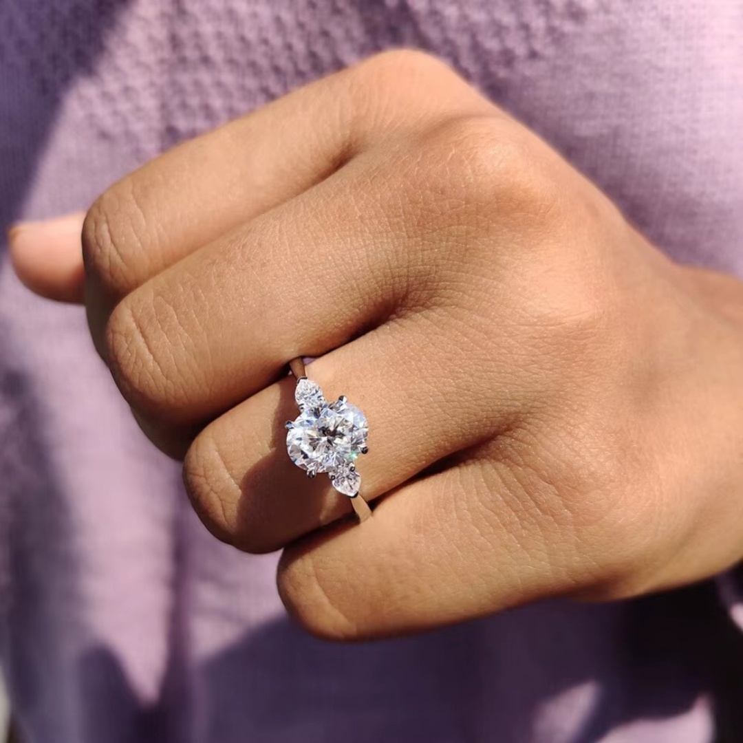 Oval Diamond and Pear Diamond Three Stone Engagement Ring