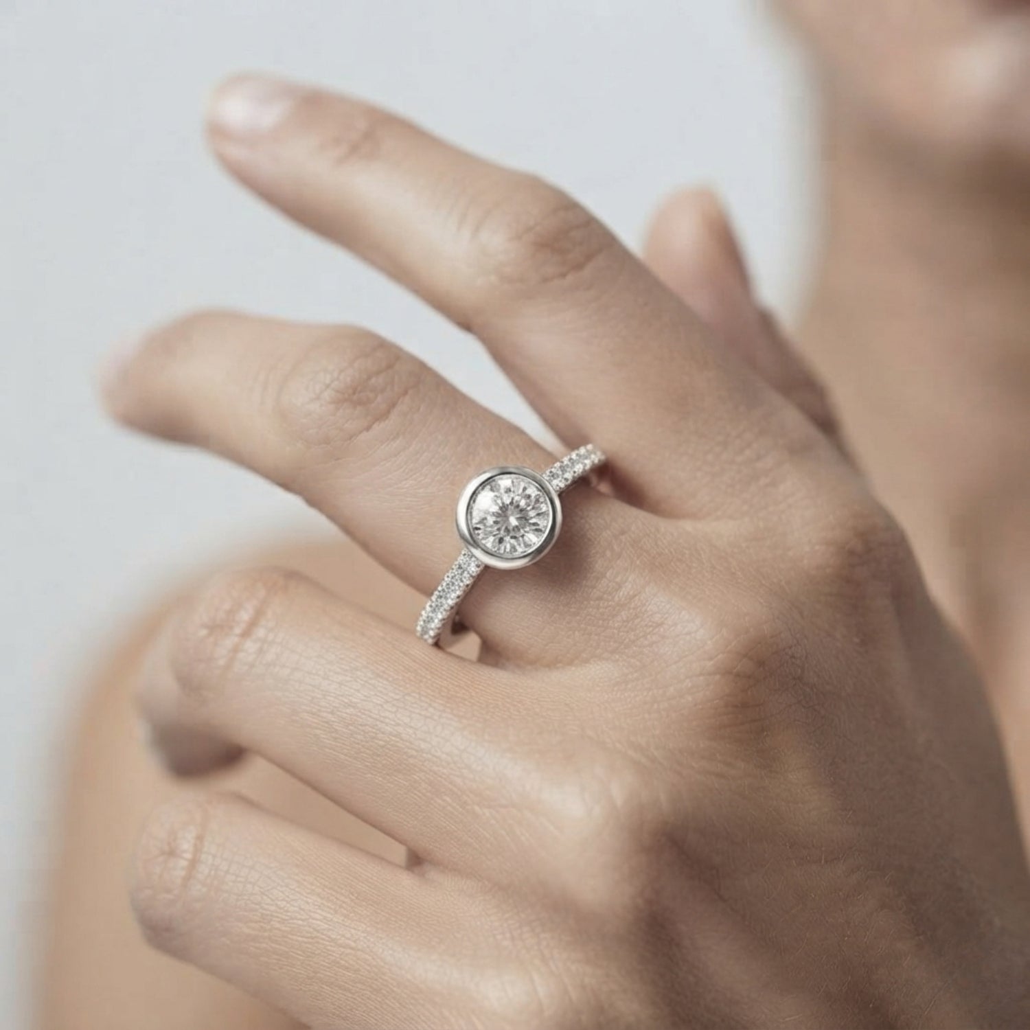 Round Diamond Bezel Set Solitaire Ring with Pavé Band in White Gold