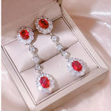 0.47Ct Ruby and Diamond Dangle Drop Earrings in White Gold