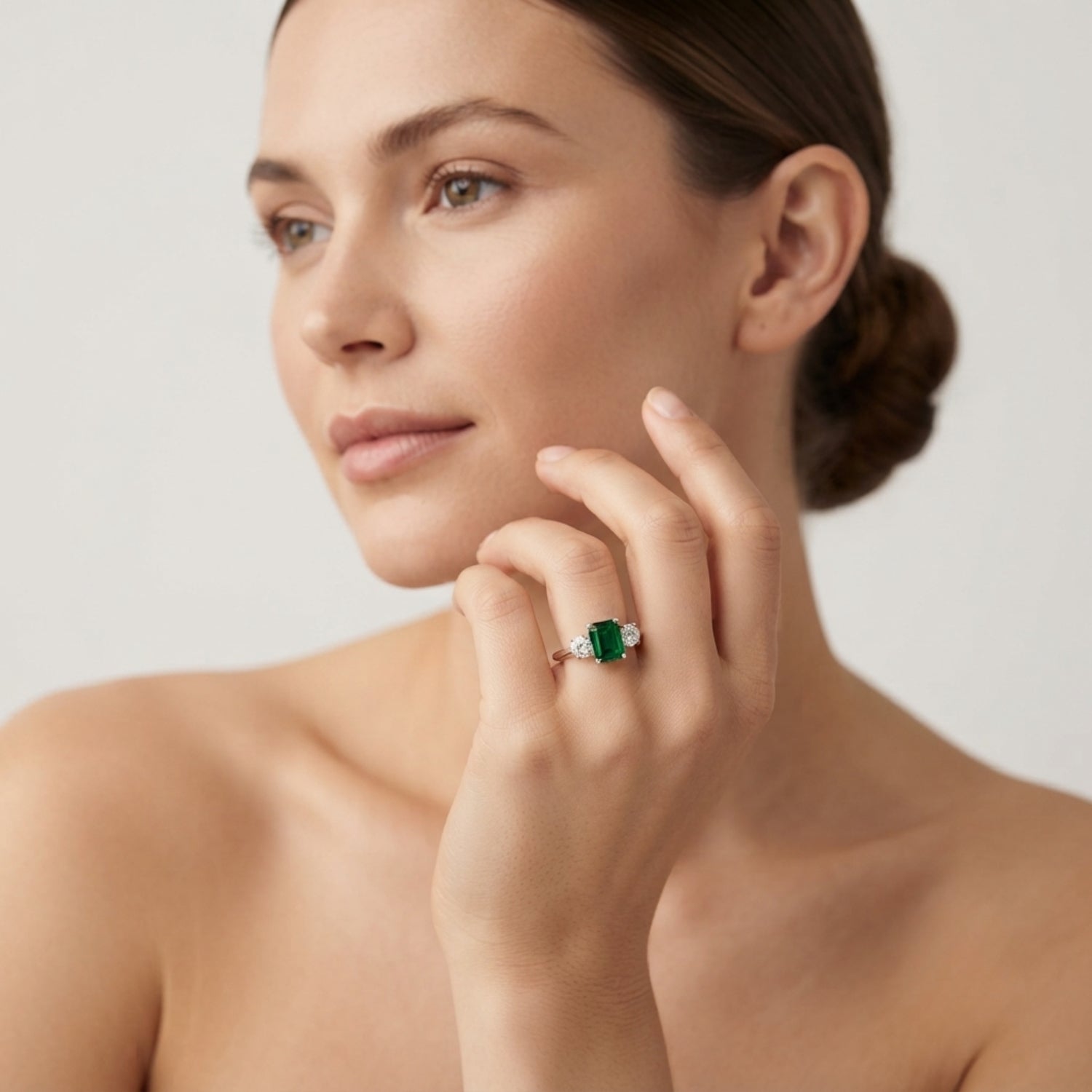 Emerald Trilogy Ring with Round Diamond Side Stones | Three Stone Ring
