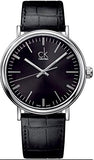 Calvin Klein watch with black leather strap and black dial on a white background