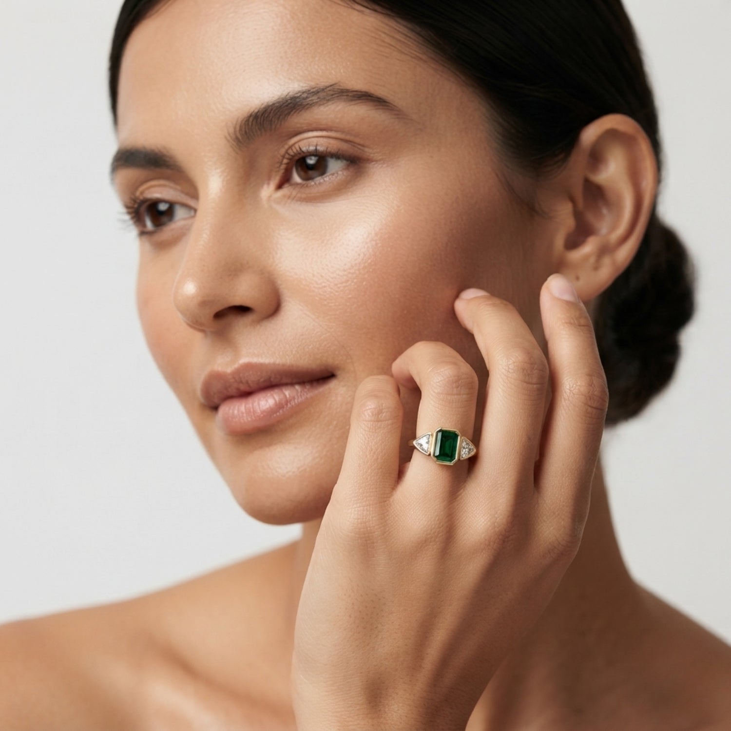 Emerald Cut Green Emerald Three Stone Ring with Trillion Diamond Side Stones | Bezel Set