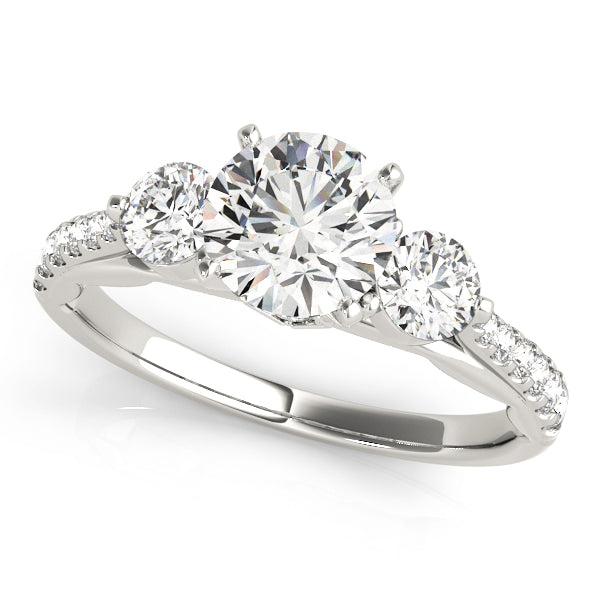 Diamond ring with three clear gemstones on a white background