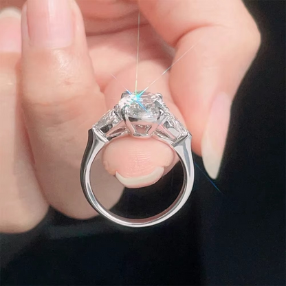 Oval Diamond and Pear Diamond Three Stone Engagement Ring