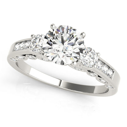 Diamond ring with three clear gemstones on a white background