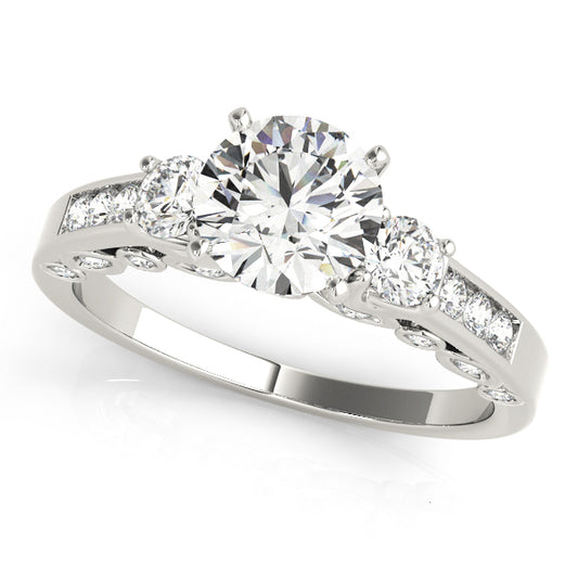 Diamond ring with three clear gemstones on a white background