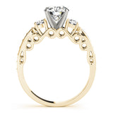 Gold ring with a diamond on a white background