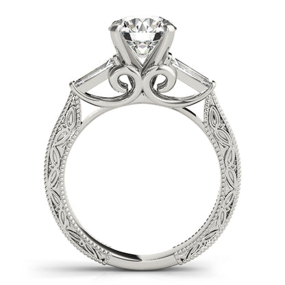 Silver ring with intricate design and a central diamond on a white background