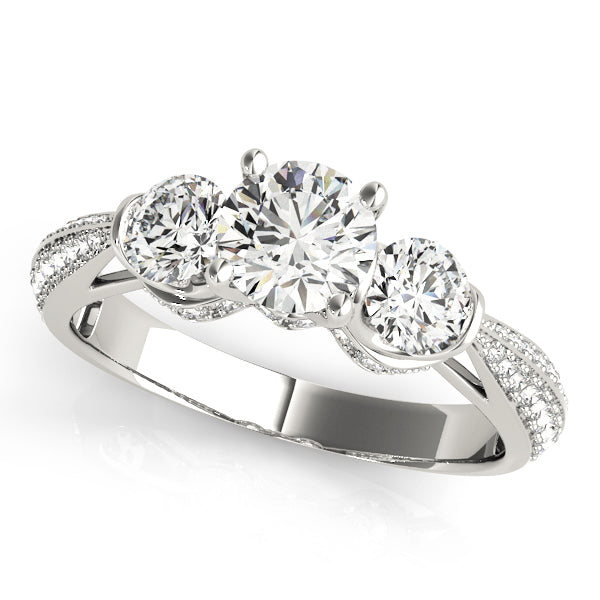 Three-stone diamond ring on a white background