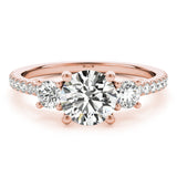 Rose gold ring with a large diamond and two smaller diamonds 