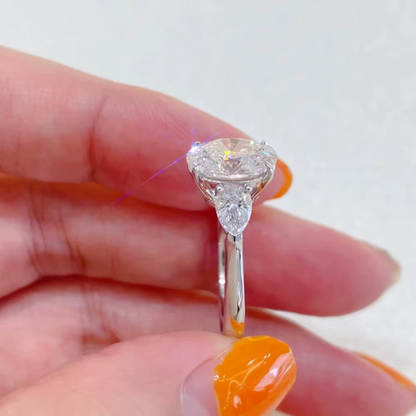 Oval Diamond and Pear Diamond Three Stone Engagement Ring