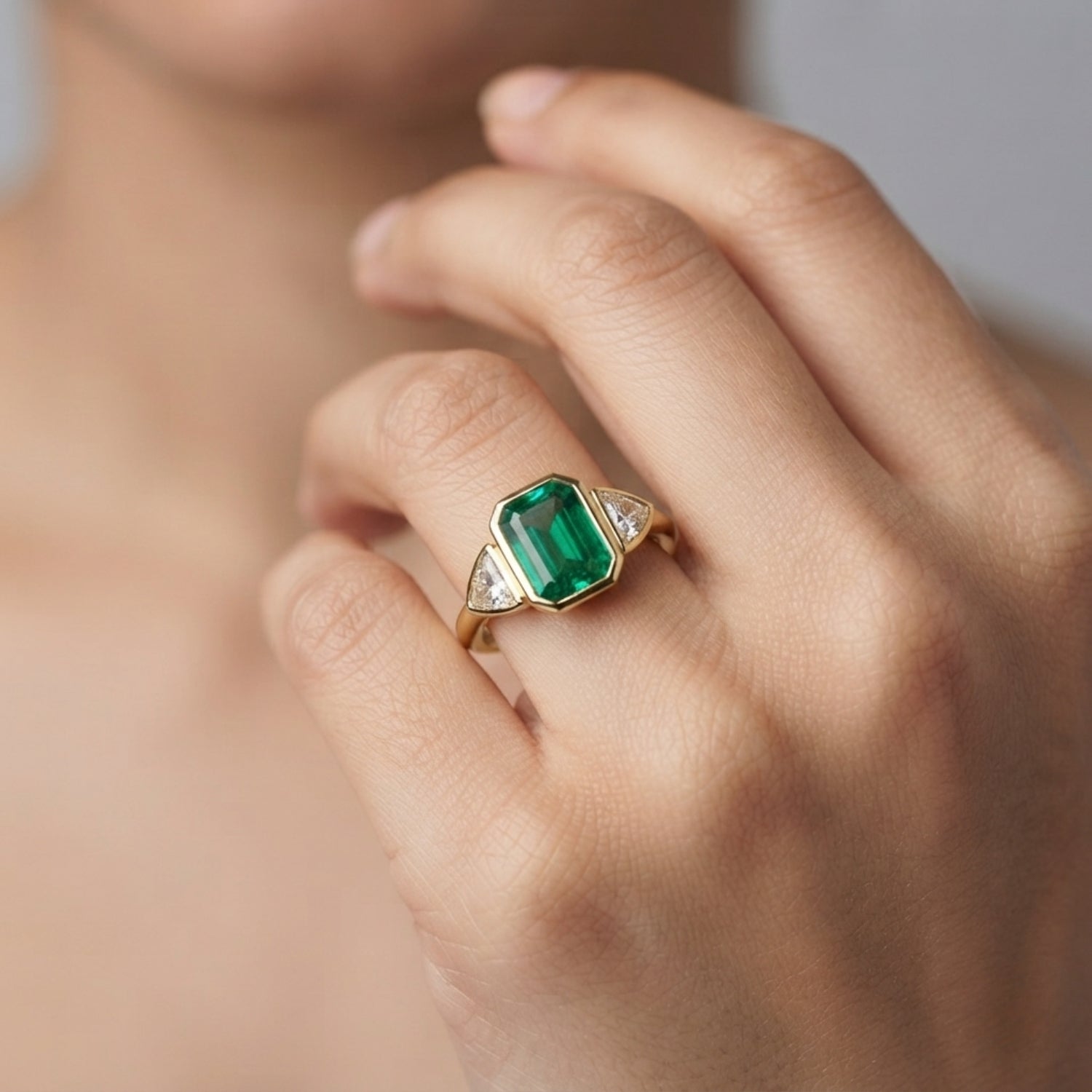 Emerald Cut Green Emerald Three Stone Ring with Trillion Diamond Side Stones | Bezel Set