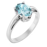 Oval Sky Blue Topaz Solitaire Ring in Gold