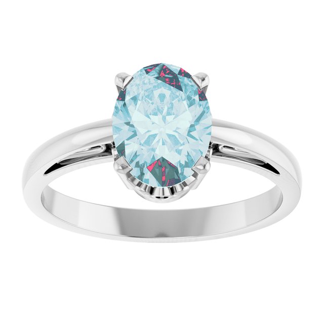 Oval Sky Blue Topaz Solitaire Ring in Gold