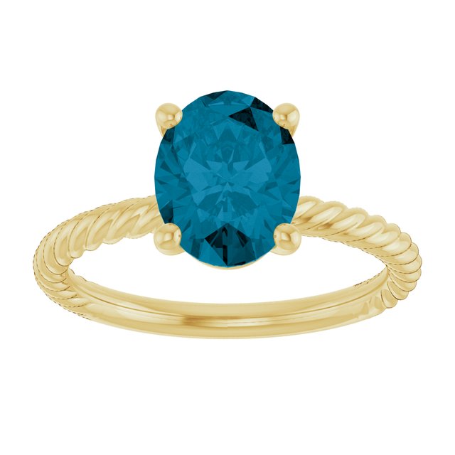 Oval London Blue Topaz Solitaire Ring in Gold