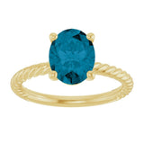 Oval London Blue Topaz Solitaire Ring in Gold
