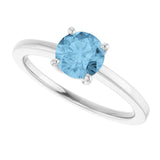 Round Sky Blue Topaz Solitaire Ring in Gold and Platinum