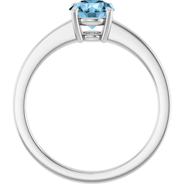 Round Sky Blue Topaz Solitaire Ring in Gold and Platinum