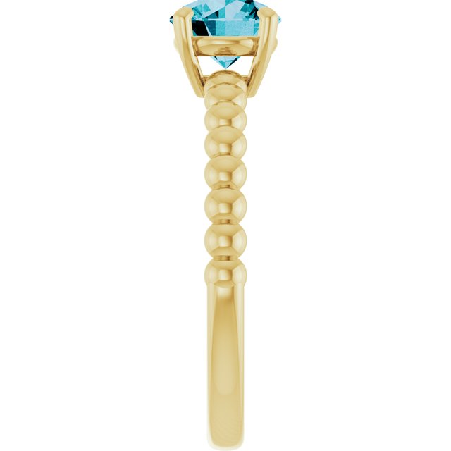Round London Blue Topaz Solitaire Ring in Gold and Platinum
