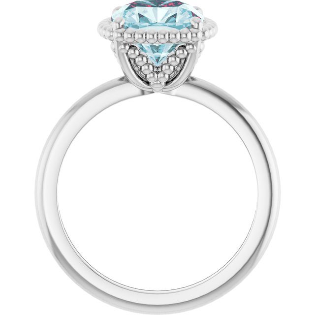 Cushion Sky Blue Topaz Solitaire Ring in Gold and Platinum