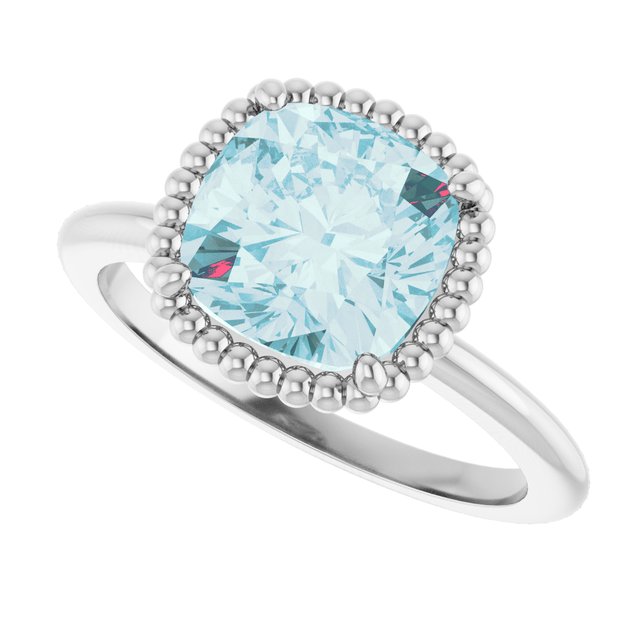 Cushion Sky Blue Topaz Solitaire Ring in Gold and Platinum