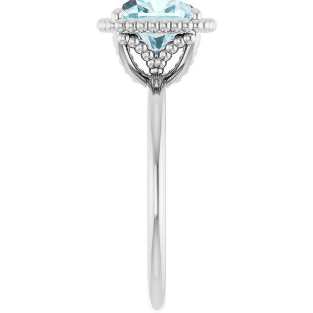 Cushion Sky Blue Topaz Solitaire Ring in Gold and Platinum