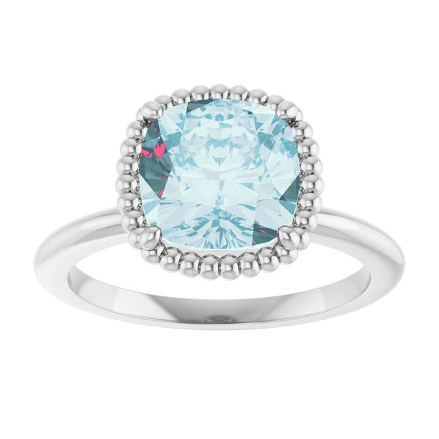 Cushion Sky Blue Topaz Solitaire Ring in Gold and Platinum