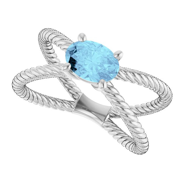 Oval Aquamarine Solitaire Ring in Gold and Platinum