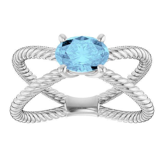 Oval Aquamarine Solitaire Ring in Gold and Platinum