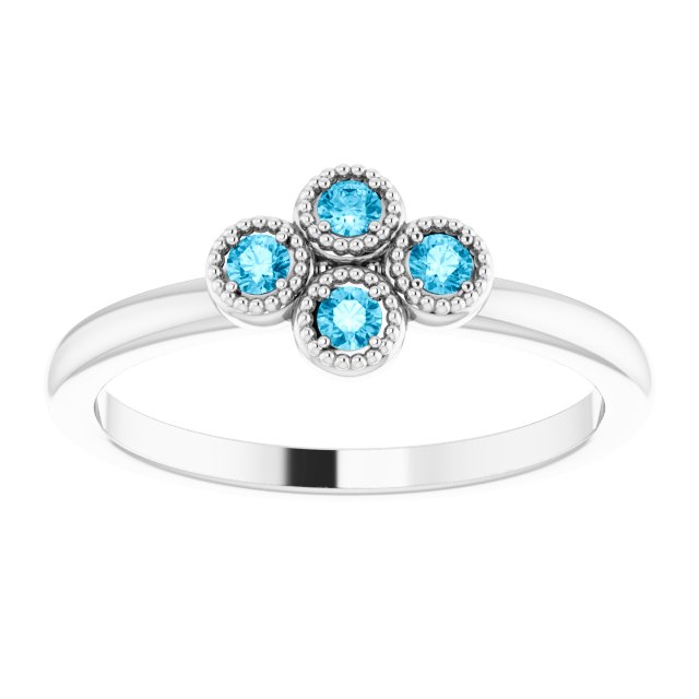 Round Aquamarine Accented Ring in Gold and Platinum