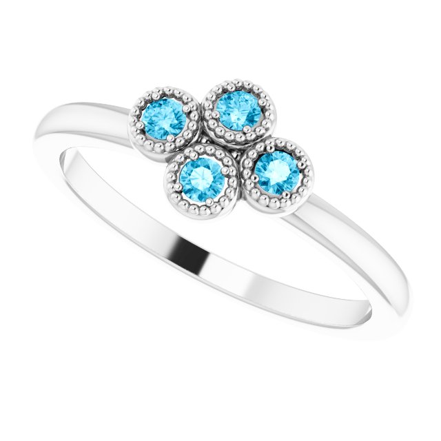 Round Aquamarine Accented Ring in Gold and Platinum