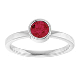 Round Ruby Solitaire Ring in Gold and Platinum