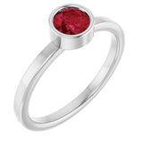 Round Ruby Solitaire Ring in Gold and Platinum